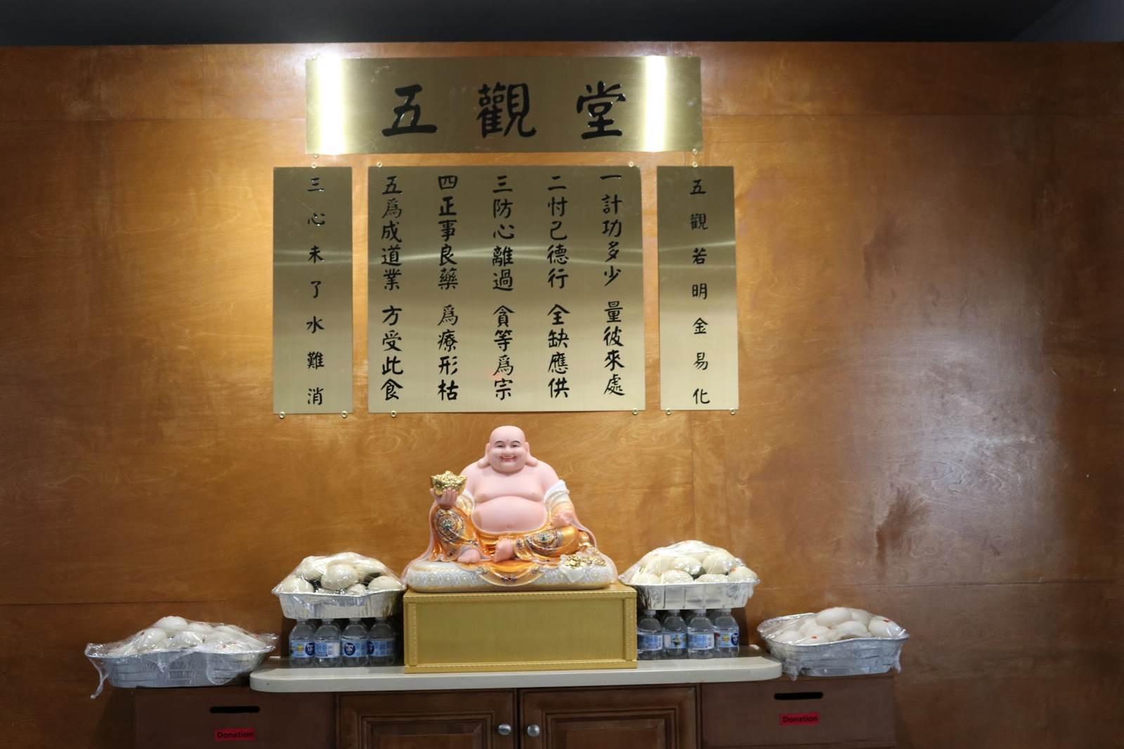 The dining hall, with the Five Contemplations on the wall