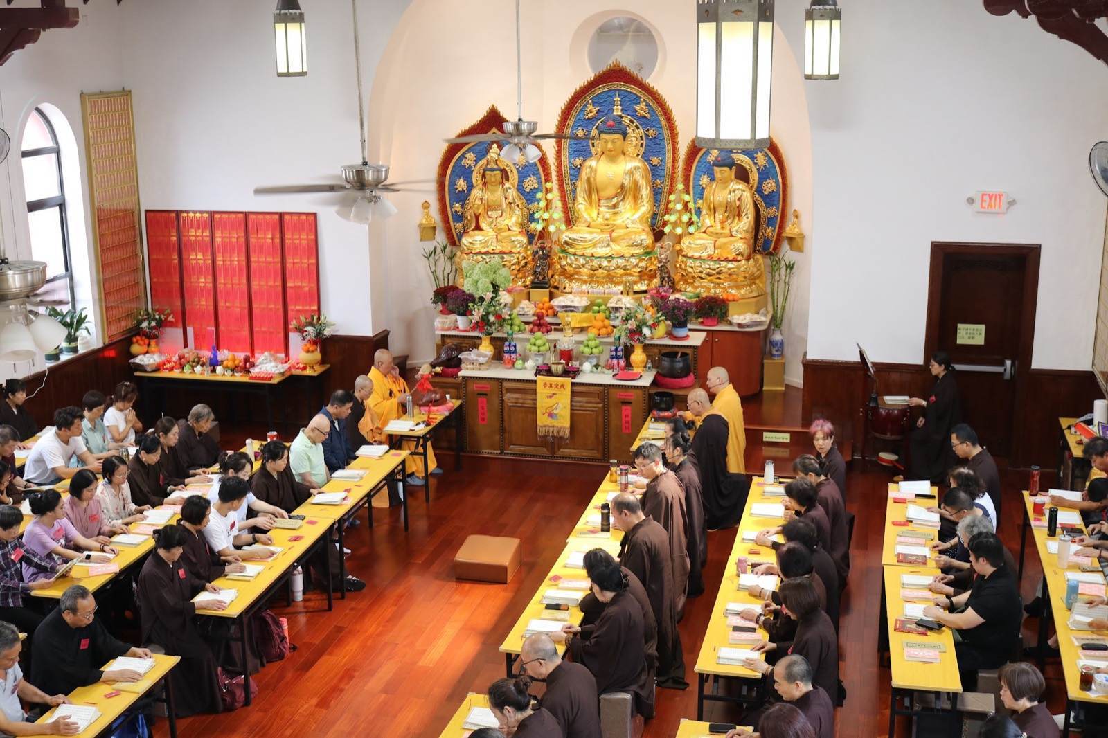 The assembly chanting together in the shrine hall