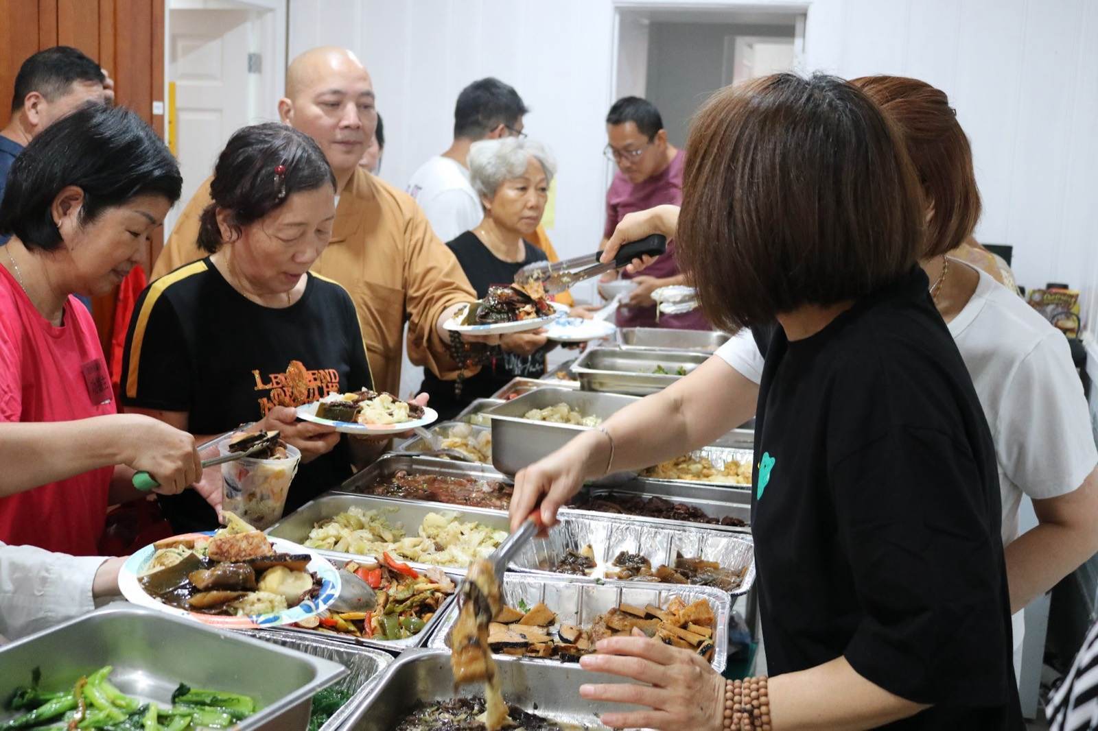 Volunteers serving a free vegetarian meal